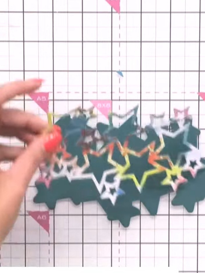 Step 4: Fussy cut away some of the stars from the backing piece to reduce the overall size if desired. This helps crea
