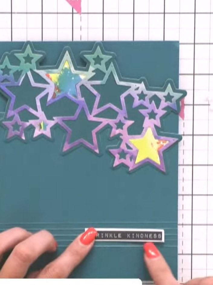 Step 8: Add a sentiment stamp to the lower portion of the card front. Position it below the star design and press firm