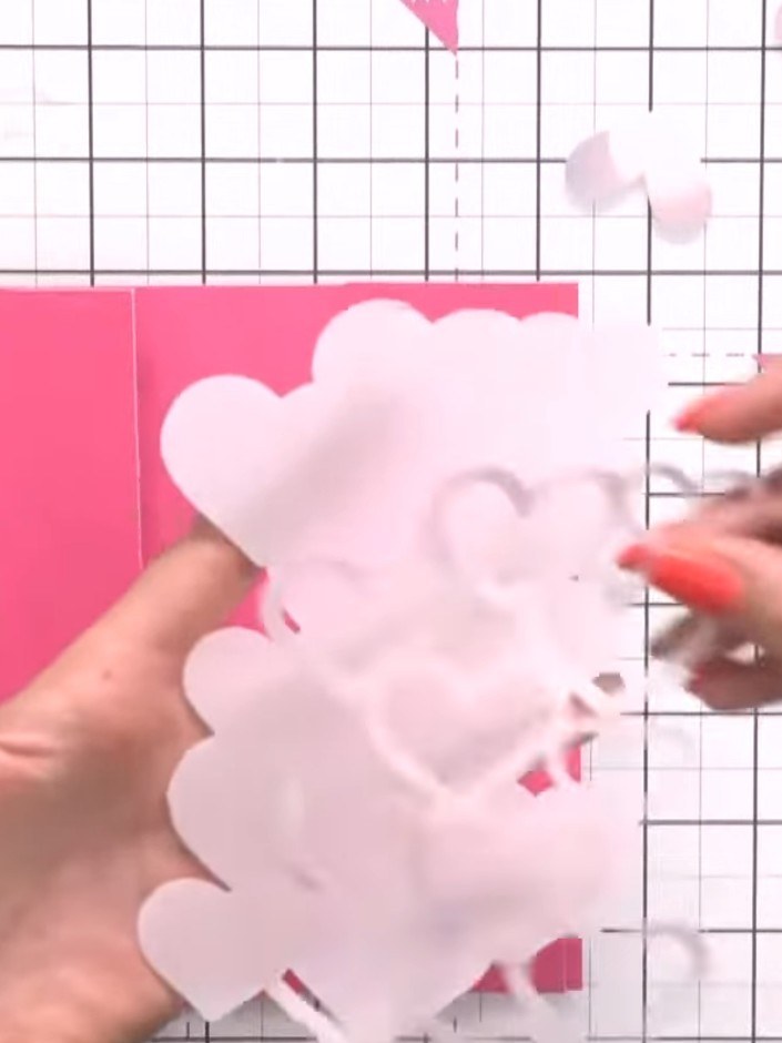 Step 4: Position the vellum heart die-cut behind the aperture window in your card blank. The vellum heart should sit c