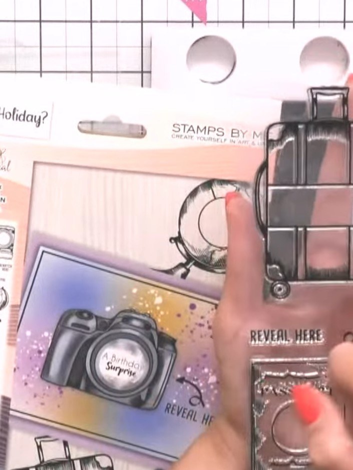Step 2: Stamp one of the surprise sentiments (such as 'Pack your bags' or 'We're going away') onto the card underneath