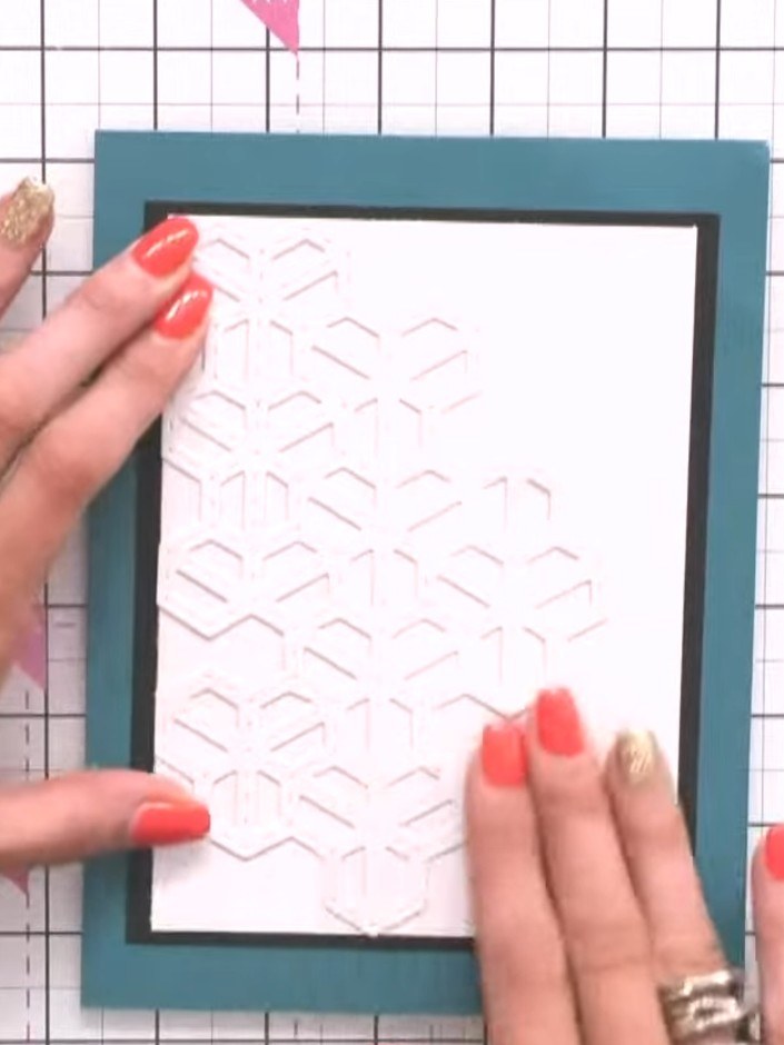 Step 3: Run white card stock through the Stylish Chevrons die to create an embossed chevron pattern background. The di