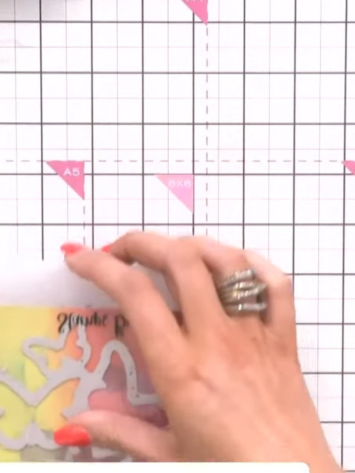 Step 1: Run the Flutterby cover plate die through your die-cutting machine with rainbow gradient patterned paper to cu