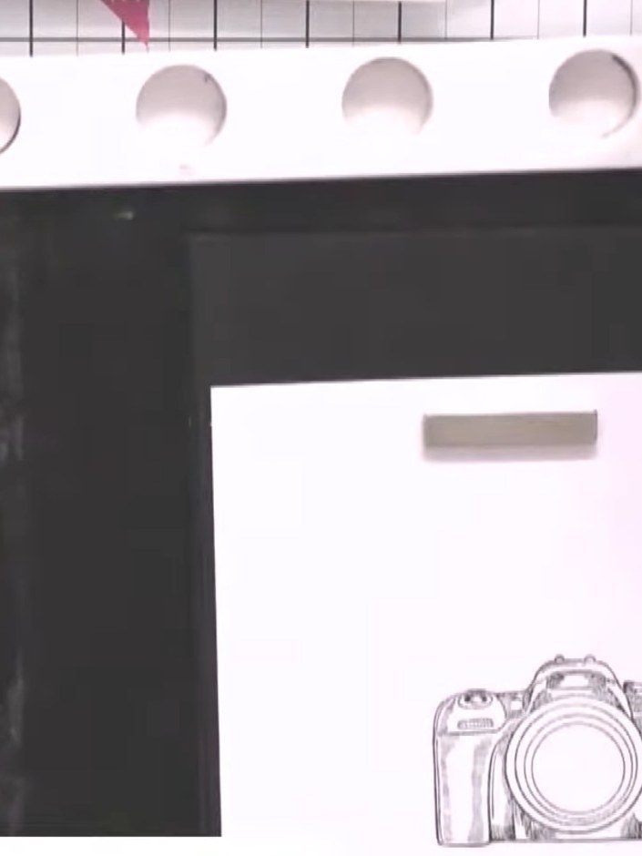 Step 1: Stamp a camera design in black ink onto two pieces of white card that are exactly the same size. Position the 