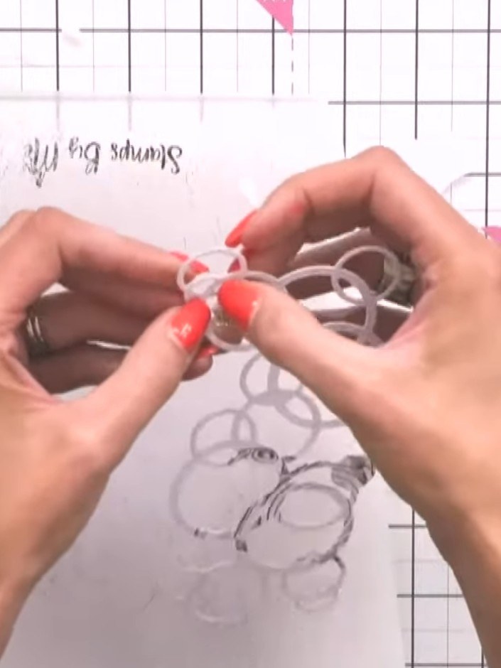 Step 3: Cut the Bubble and Fizz die three times in white card. Layer the three die-cut pieces together to create a thi