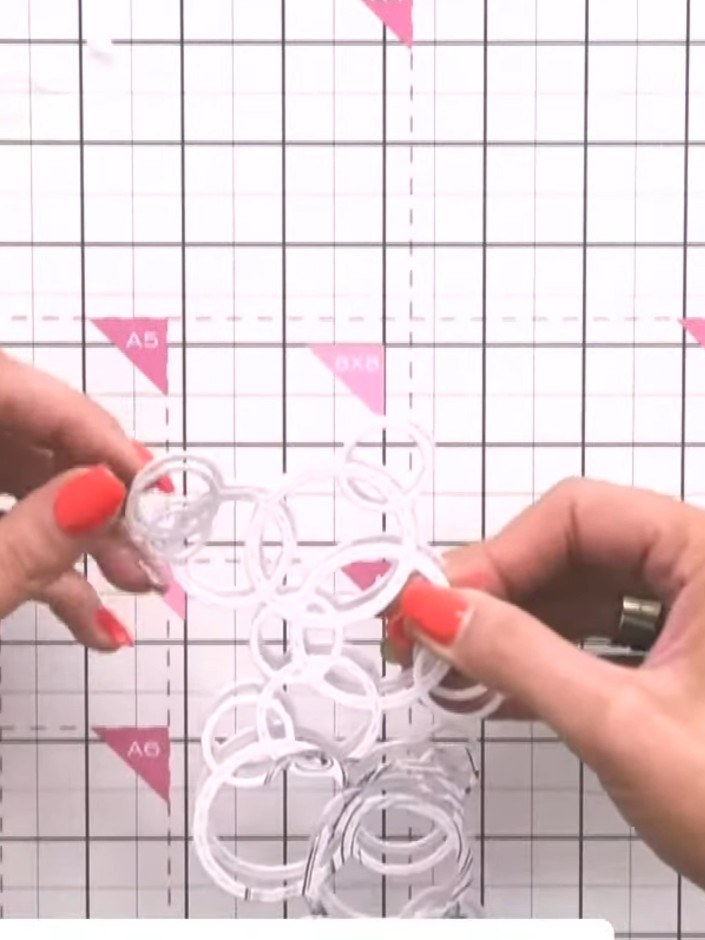 Step 4: Glue the layered white Bubble and Fizz embellishment onto the pink card blank. Position it centrally on the ca