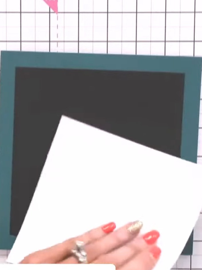 Step 7: Layer the white square with the suitcase design onto the dark grey card, then mount onto the teal card base. P