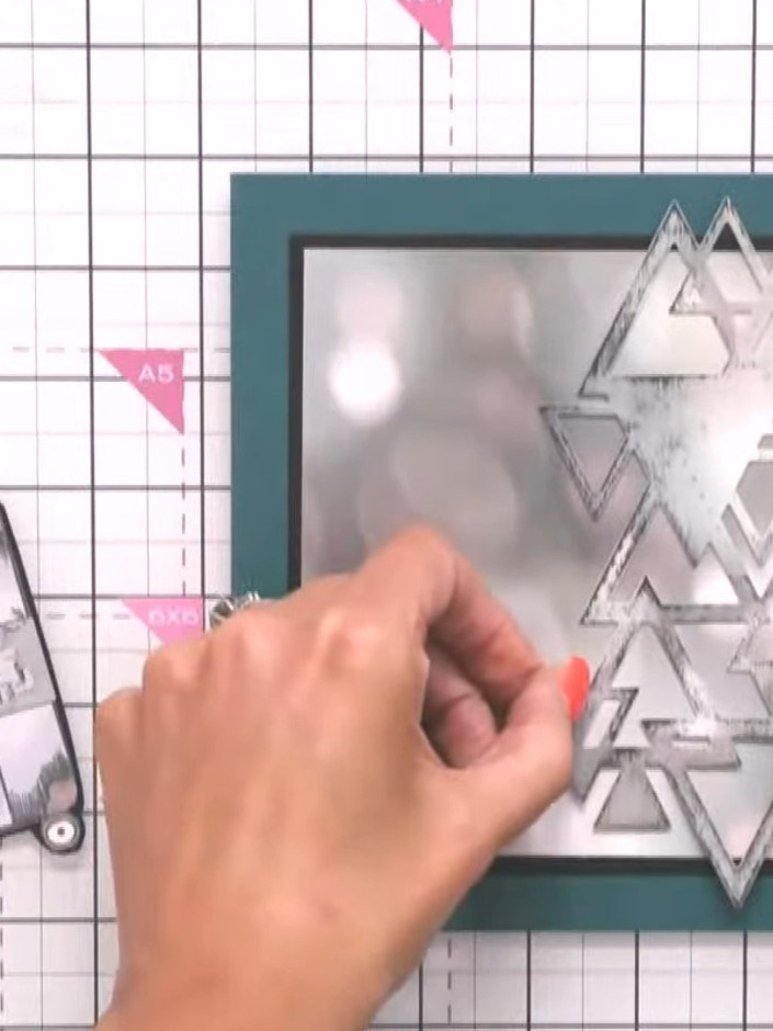 Step 8: Stamp triangle designs down the left side of the card using the triangle stamp from the set. Position the tria