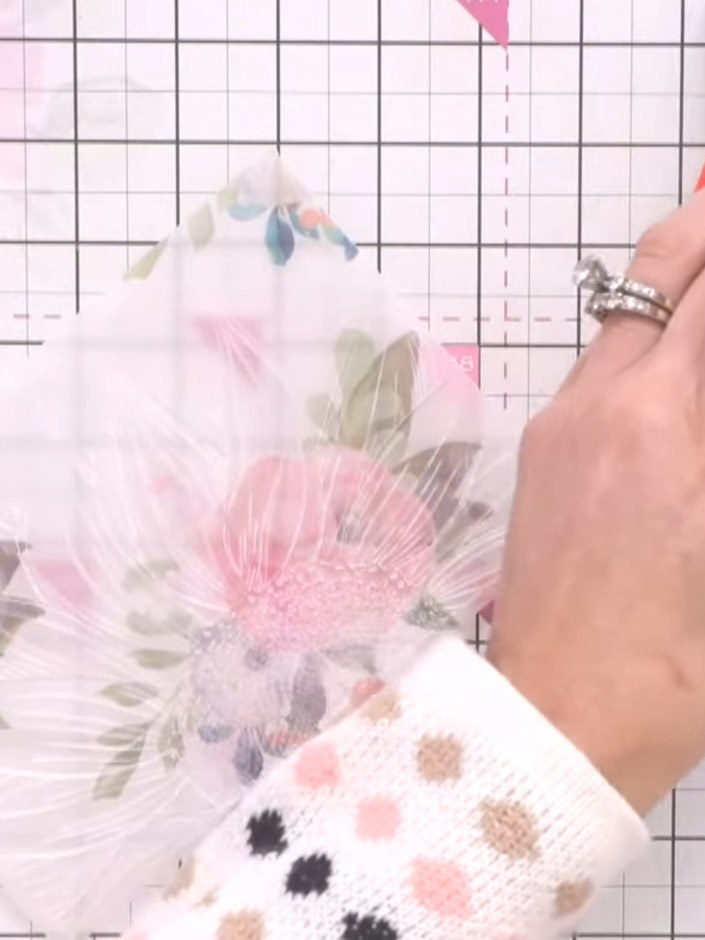 Step 4: Turn the vellum piece over so the front is facing up. Using white ink on an ink blending tool, gently blend ac