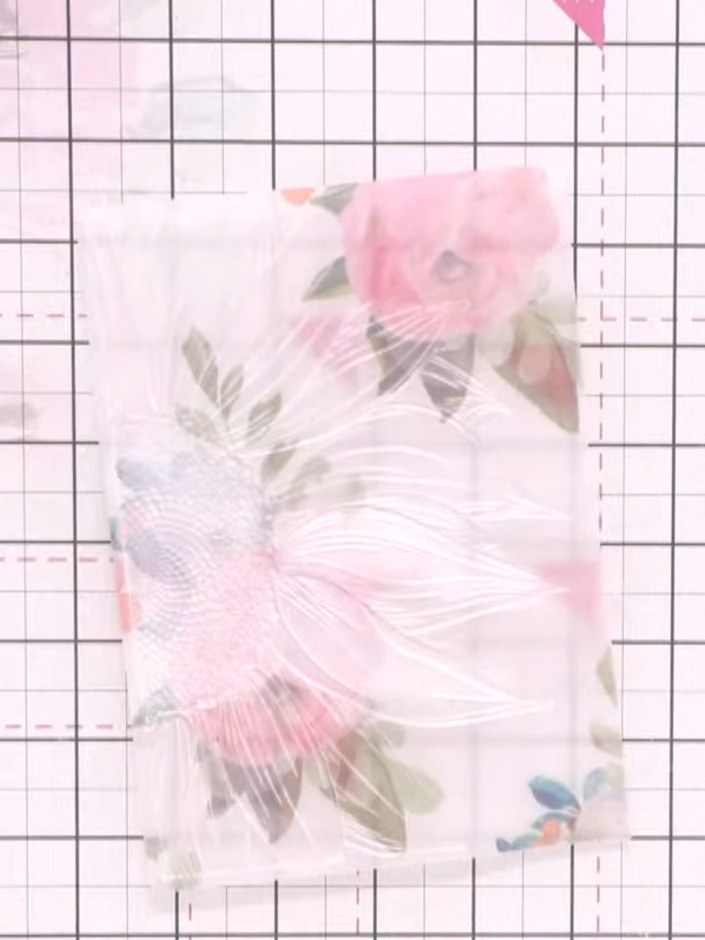 Step 5: Place different coloured cardstocks behind the vellum piece to see how they affect the appearance of the embos