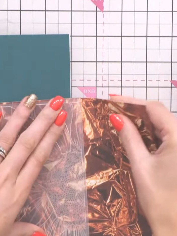 Step 2: Run the foiled paper through your die-cutting machine using thick plates to emboss the design. Ensure the foil