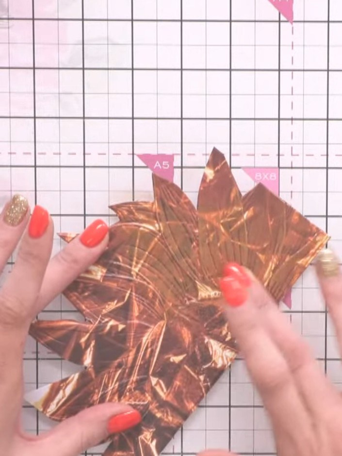 Step 5: Flatten out the metallic copper foil pieces on your craft mat using a white ink pad to smooth them down and pr