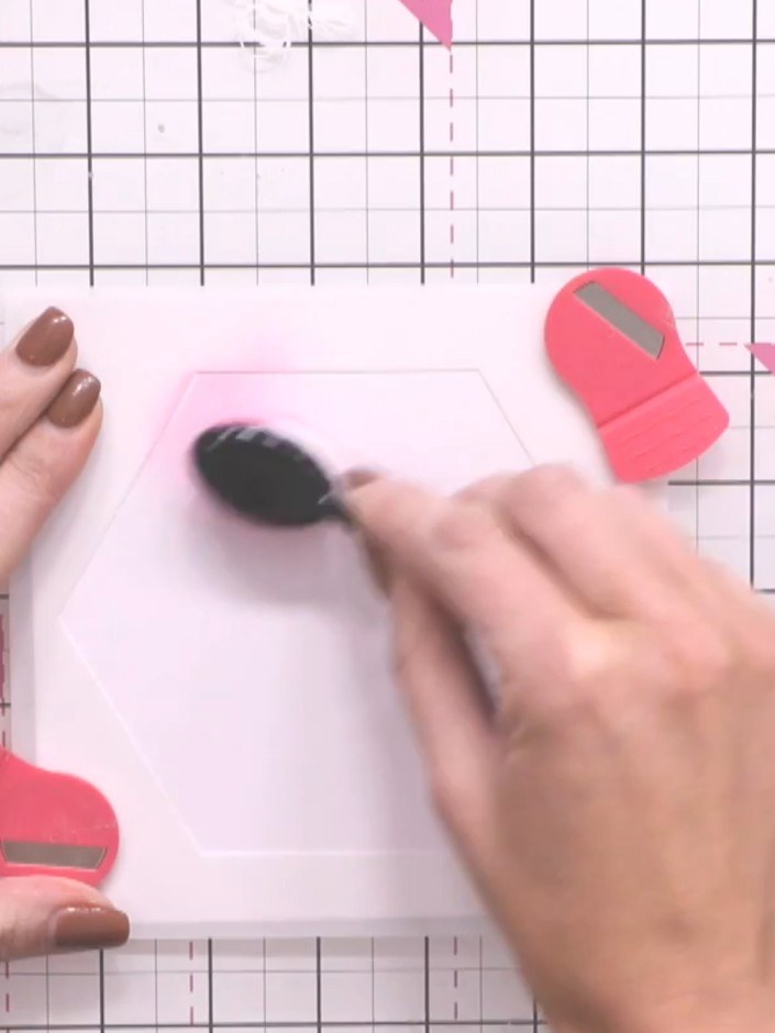 Step 3: Apply distress ink through the hexagon stencil using an ink blending tool. Work the ink in circular motions to