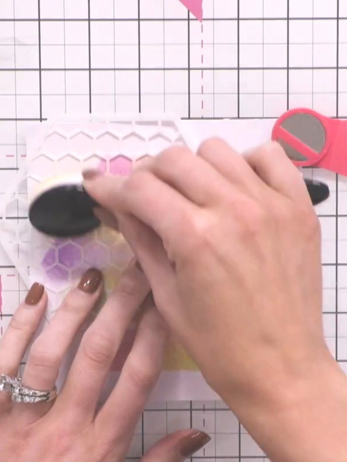 Step 6: Position the inner hexagon stencil on top of your card. Using a dry brush, add light yellow ink to the corners