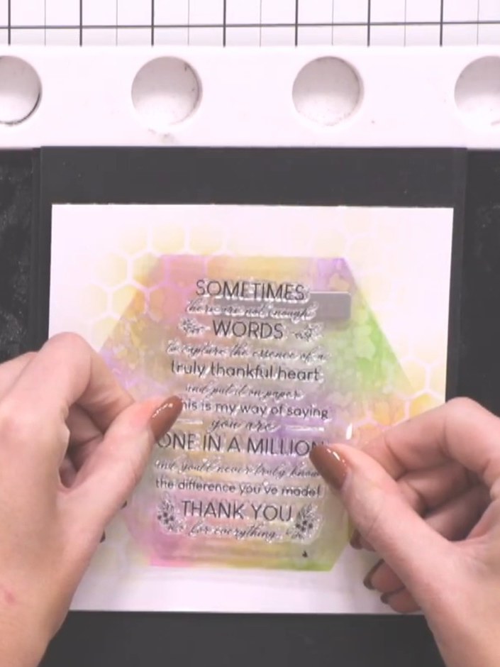 Step 9: Stamp the sentiment 'sometimes there are not enough words...' in black ink onto white card stock. Position the