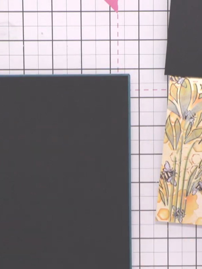Step 11: Layer the stencilled panel onto the black mat, then mount both onto the teal card base. Position each layer to