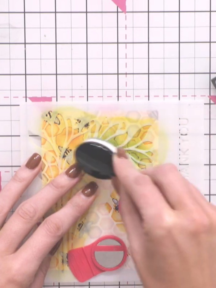 Step 6: Using a blending tool, apply teal or green ink over the yellow stencilled areas to add depth and shadow to the