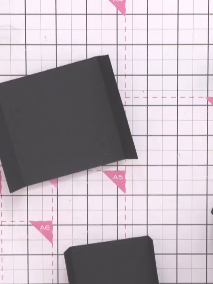 Step 4: Glue the five black hinge pieces together, nesting each smaller piece inside the larger one. Centre them caref