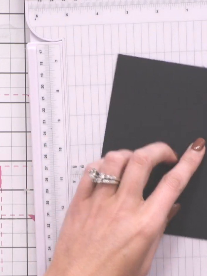 Step 5: Cut ten pieces of black cardstock measuring 9cm × 15cm. These will form the album pages that attach to the hin