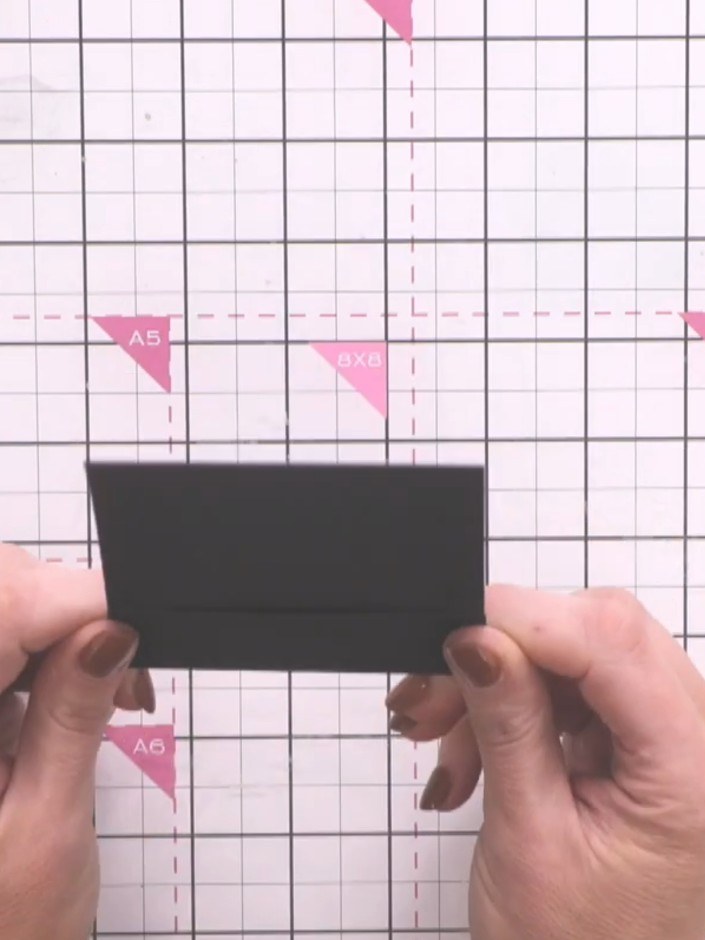 Step 7: Glue the sides of the scored section to create pockets on all ten black pages. Alternatively, leave some unglu