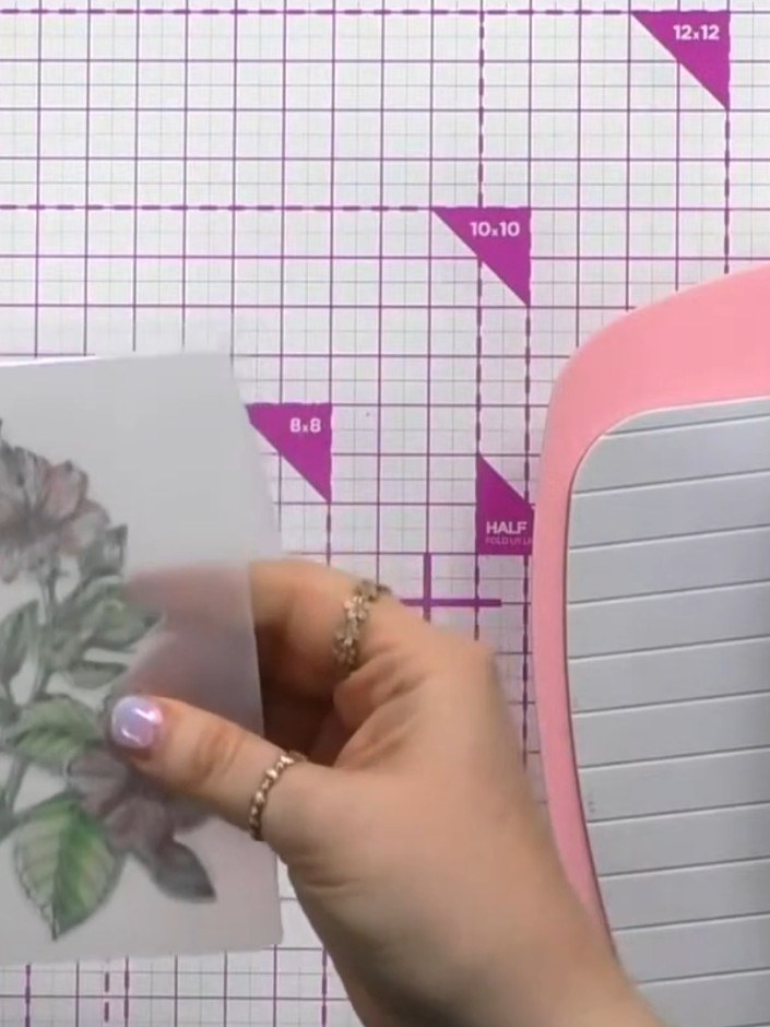Step 10: Run the embossing folder with your hibiscus image through your die-cutting machine to add the final embossed d