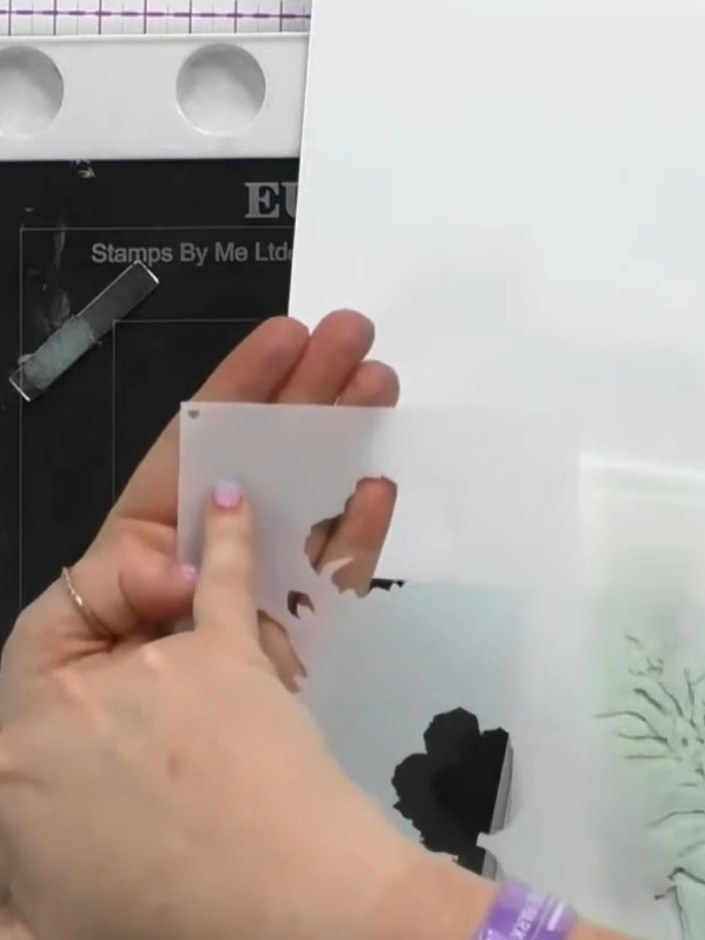 Step 2: Apply pale pink ink through the first stencil onto your card. Use the heart shape as a registration guide to h