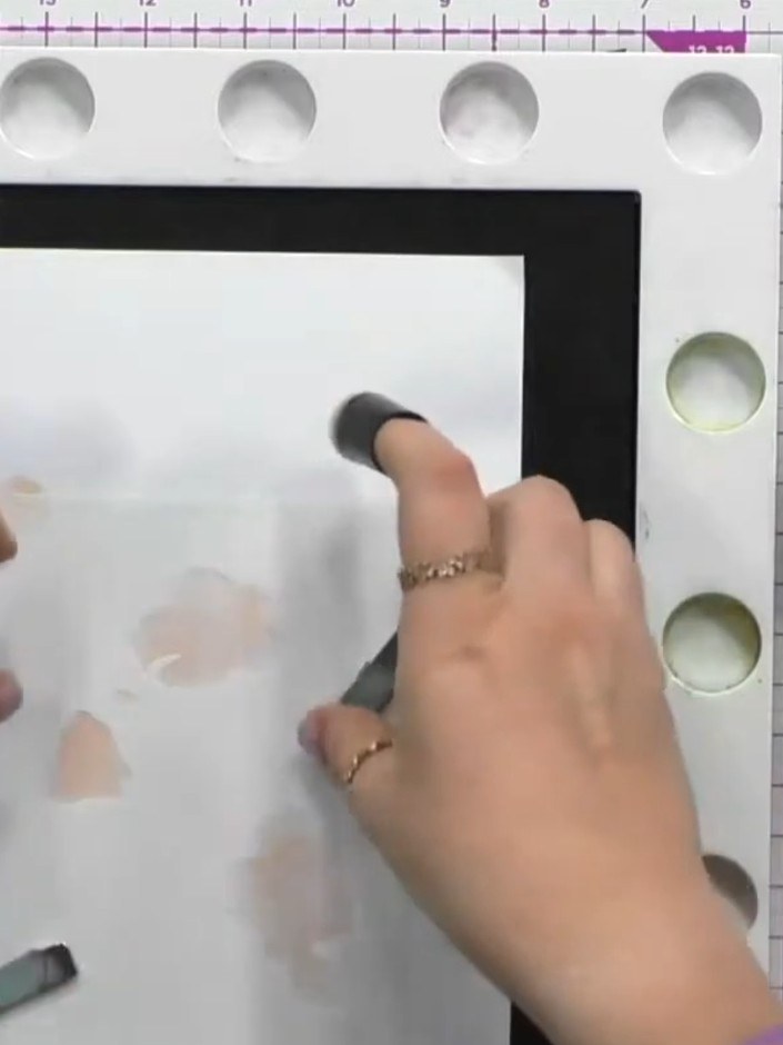 Step 3: Line up stencil number two using the heart registration mark and apply rose bud pink ink through the stencil o