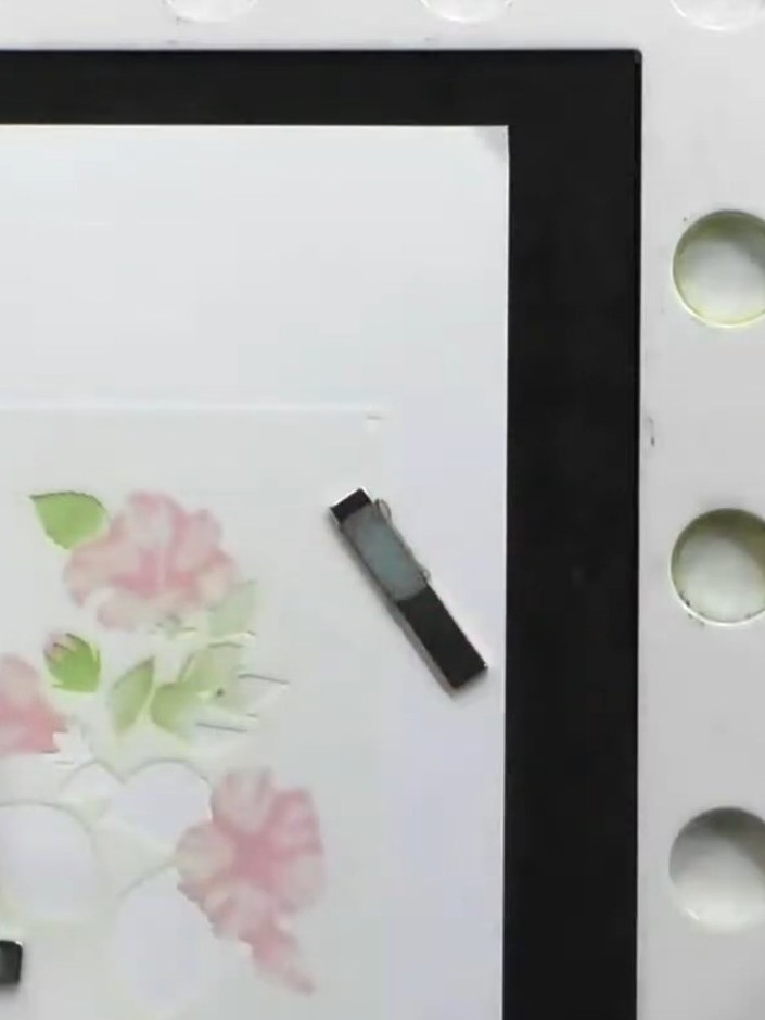 Step 5: Apply stencils four, five and six using varying shades of green ink to create the foliage and leaves on your c