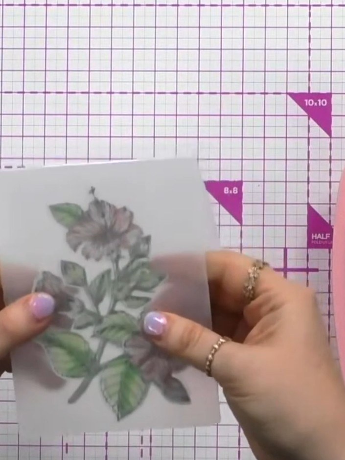Step 9: Place your die-cut hibiscus into the embossing folder, aligning the raised section inwards for a boss emboss e