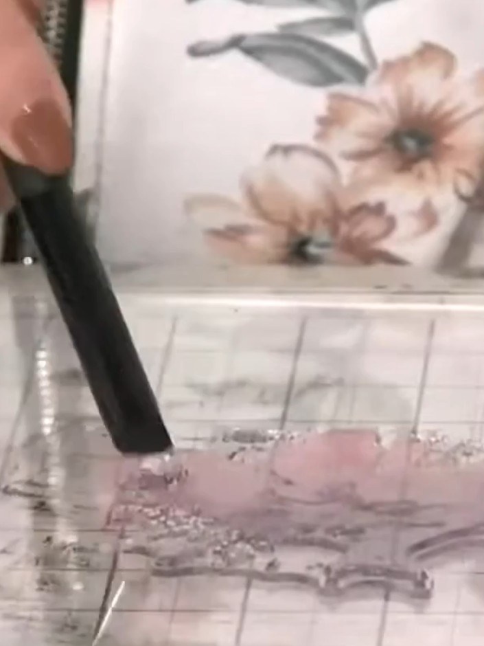 Step 2: Spray the inked stamp lightly with water using a water spray bottle. This will help the colours blend together