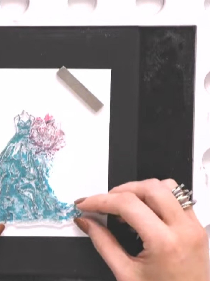 Step 6: If desired, lightly swipe a white ink pad across the embossed surface to highlight the raised areas. This will