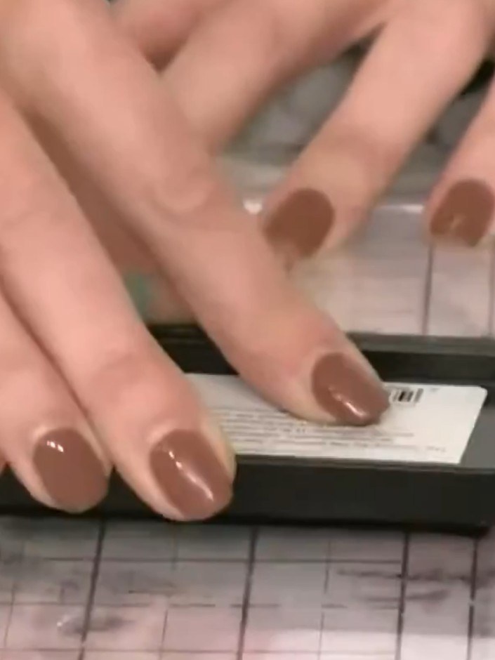 Step 7: Mount your embossed floral panel onto a black card base. Position the panel centrally and secure it in place w