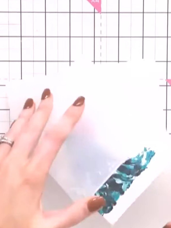 Step 4: Cut out a second stamped gown image. Apply glitter or sparkle to the dress portion of the image to add dimensi
