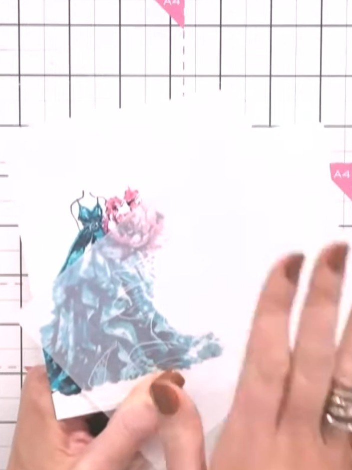 Step 6: Select a floral embossing folder and run a piece of card through your die-cutting machine to create a decorati