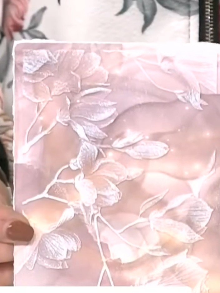 Step 3: Run the embossing folder with the white ink design and your coloured card through your die-cutting machine to 