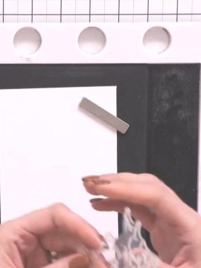Step 2: Spray the inked area with water to create a watercolour effect. Repeat the process 2–3 times to build up the d