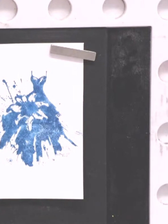 Step 1: Ink the bottom section of the solid portion stamp with your first colour, such as teal or blue. Apply the ink 