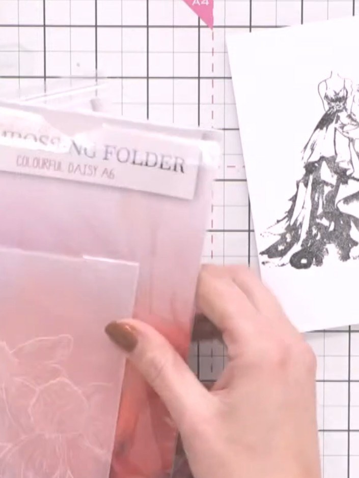 Step 2: Select an embossing folder with a floral or complementary design, such as the Wild and Beautiful folder. Place