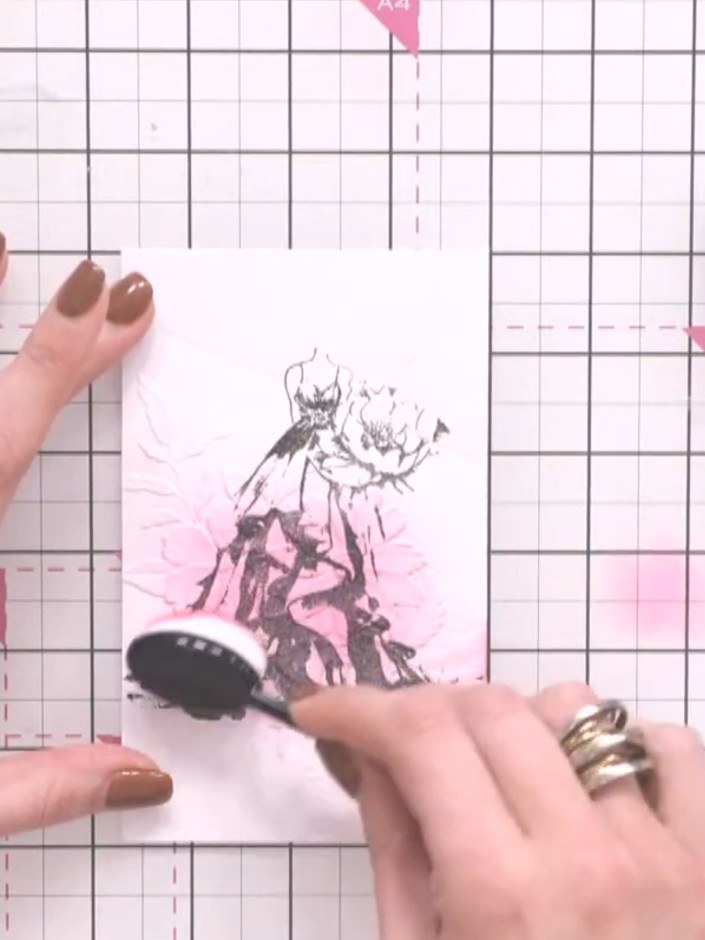 Step 8: Use the blending tool to add pink ink around the edges of the stamped image, blending outwards to create a sof