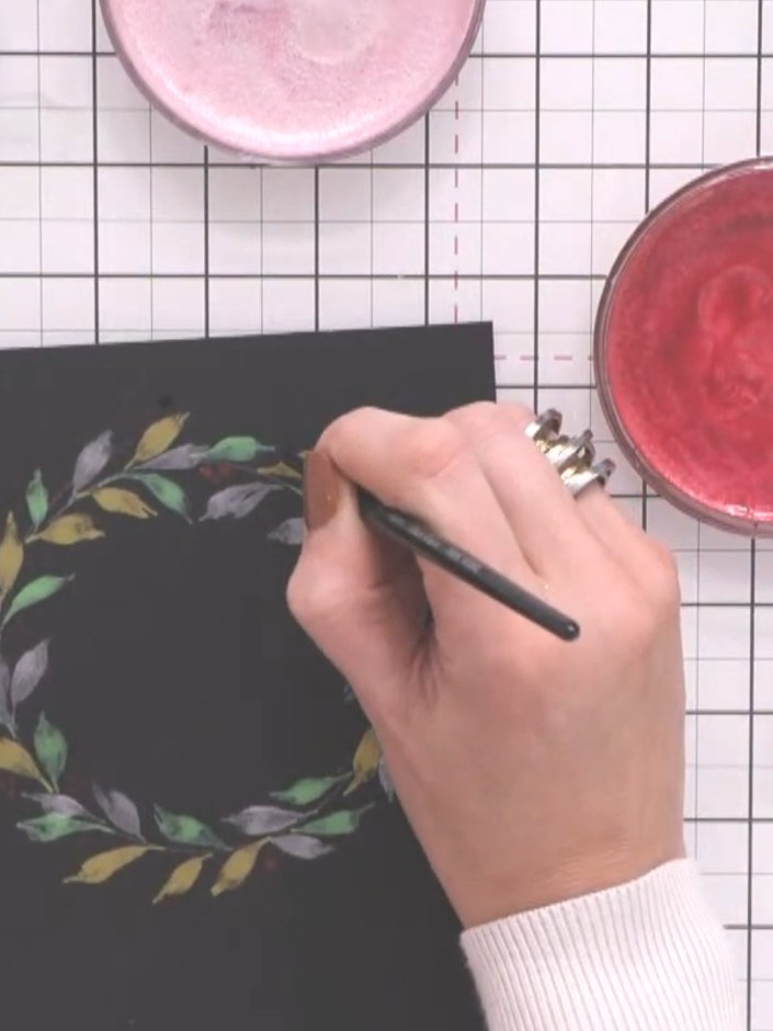 Step 8: Allow the painted wreath to dry completely. Once dry, mount the finished piece onto a contrasting card base to