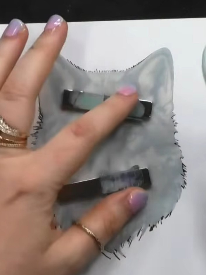 Step 4: Using a blending tool with blue ink, blend colour around the masked wolf image to create contrast against the 