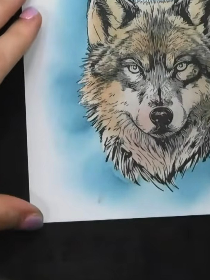Step 7: For a three-wolf effect, position the mask over your stamped wolf image and stamp again to create additional w
