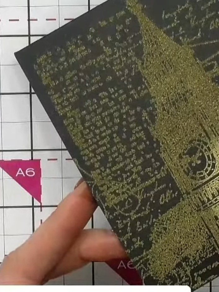 Step 8: Allow the embossed card to cool completely. Once cooled, use the clock die to cut out the clock shape from the