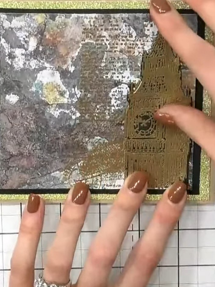 Step 7: Position the decorated panel onto the black card frame, then layer this onto the gold glitter card base to cre