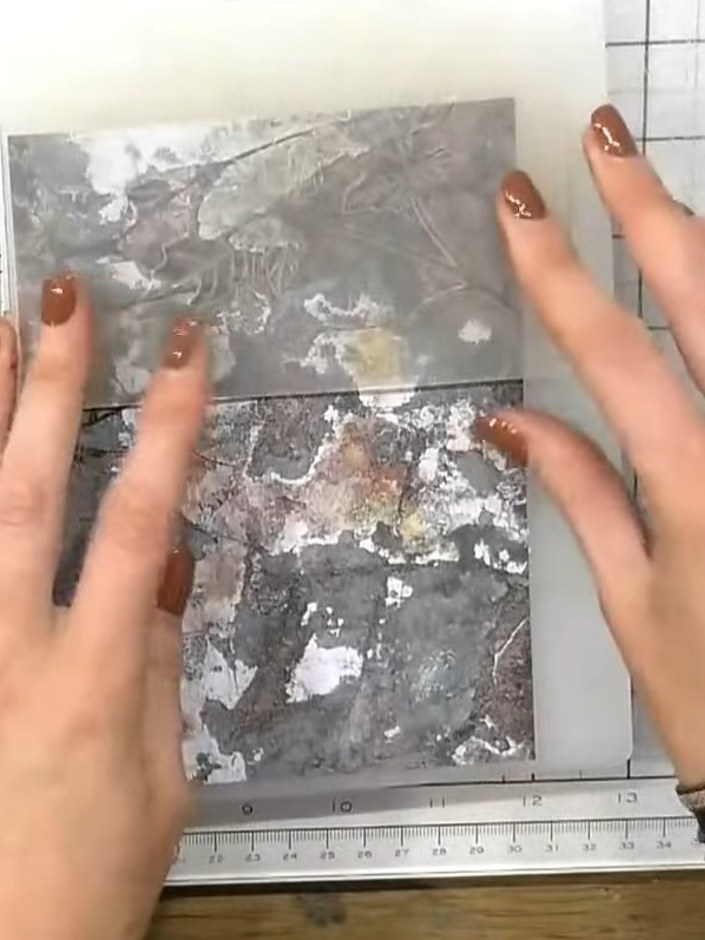 Step 5: Tap a white ink pad directly onto the raised areas of the embossed design to highlight the texture. Focus on t