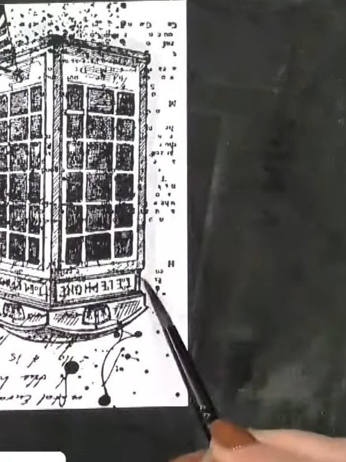 Step 4: Using a grey marker or watercolour, paint a subtle shadow around the telephone box outline to create a halo ef