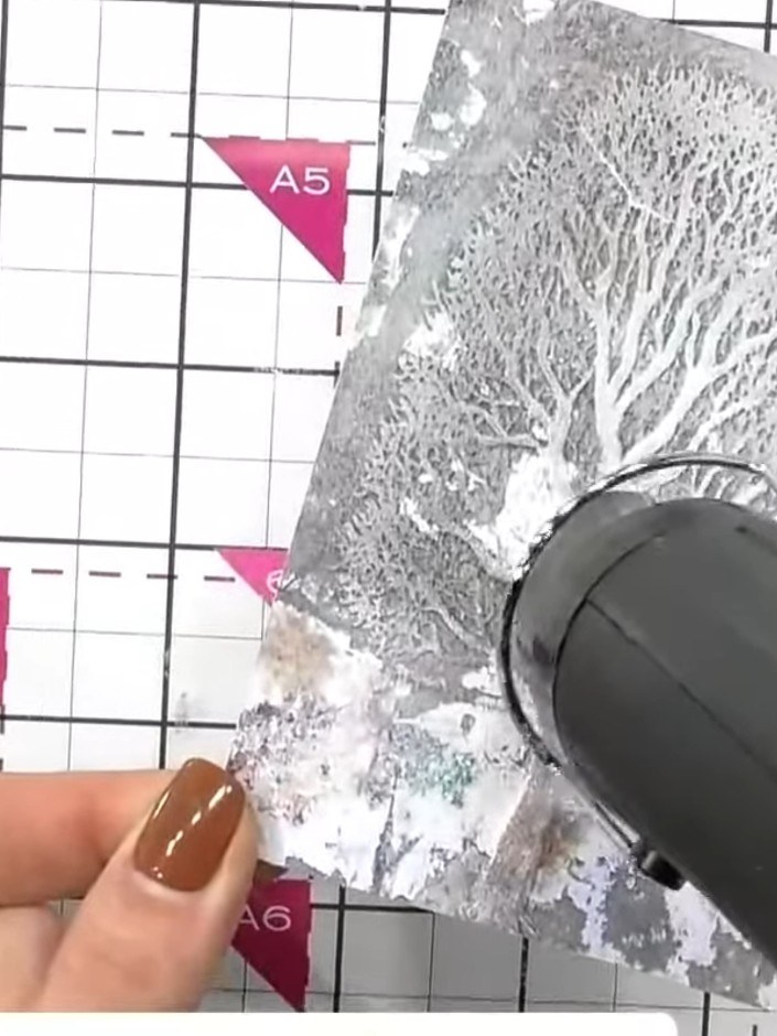 Step 4: If you're unhappy with the brown tone, apply white ink again over the embossed areas to lighten and push back 
