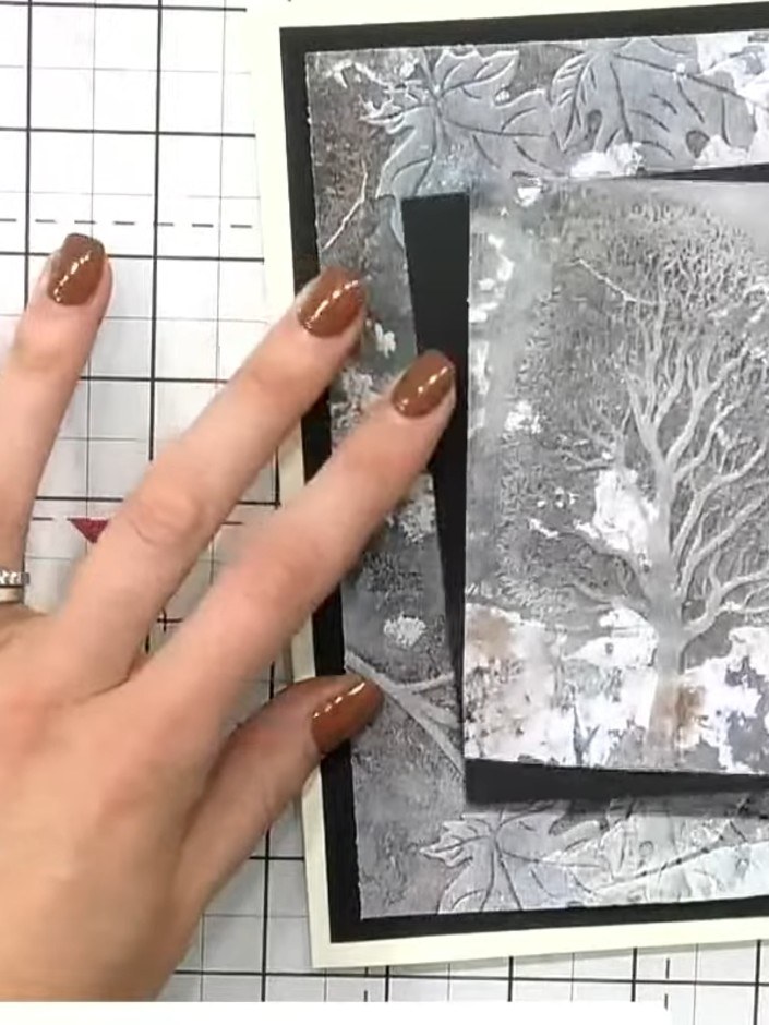 Step 7: Mount the finished embossed tree panel onto a black card blank using adhesive. Position it centrally to create