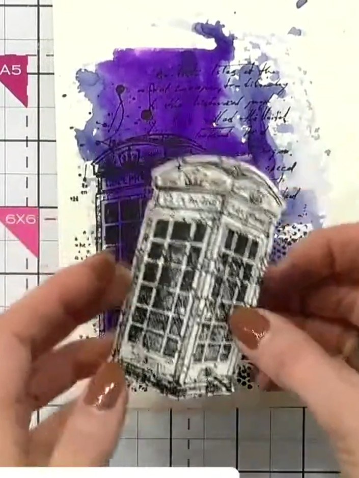 Step 9: Layer the die-cut tower onto the stamped background using foam pads to add dimension. Position the tower centr