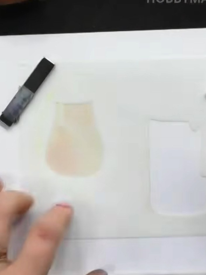 Step 2: Position stencil number two over your card, aligning it using the heart registration marks. Apply a medium bro