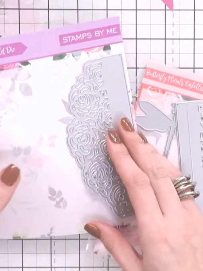 Step 2: Score along the hinge lines of the die-cut floral panel. Fold the panels inward to create an envelope-like wra